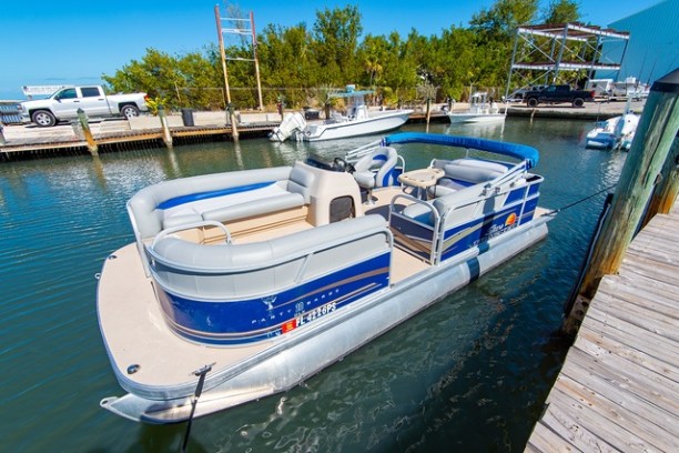 a boat is docked next to a body of water