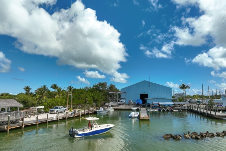 a boat is docked next to a body of water