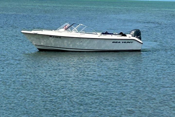 a small boat in a large body of water