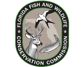 Emblem of Florida Fish and Wildlife Conservation Commission with deer, fish, and bird.
